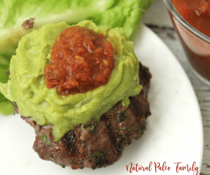 paleo taco burger with guacamole and salsa on lettuce wrap