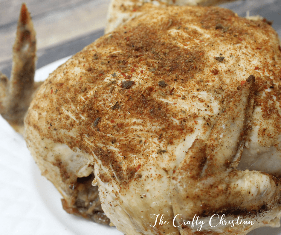 crockpot cooked whole chicken on a plate