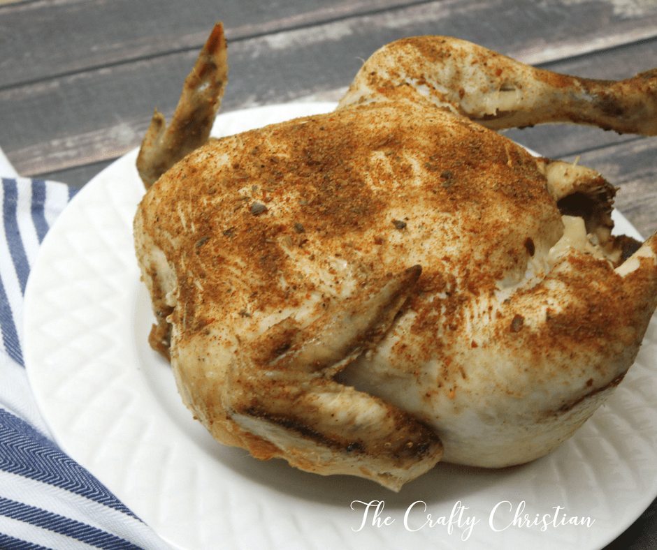 crockpot cooked whole chicken on a plate