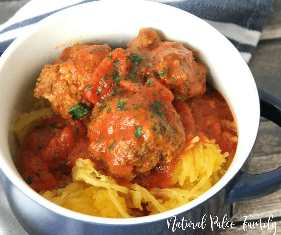 paleo meatballs and sauce on top of spaghetti squash in a bowl