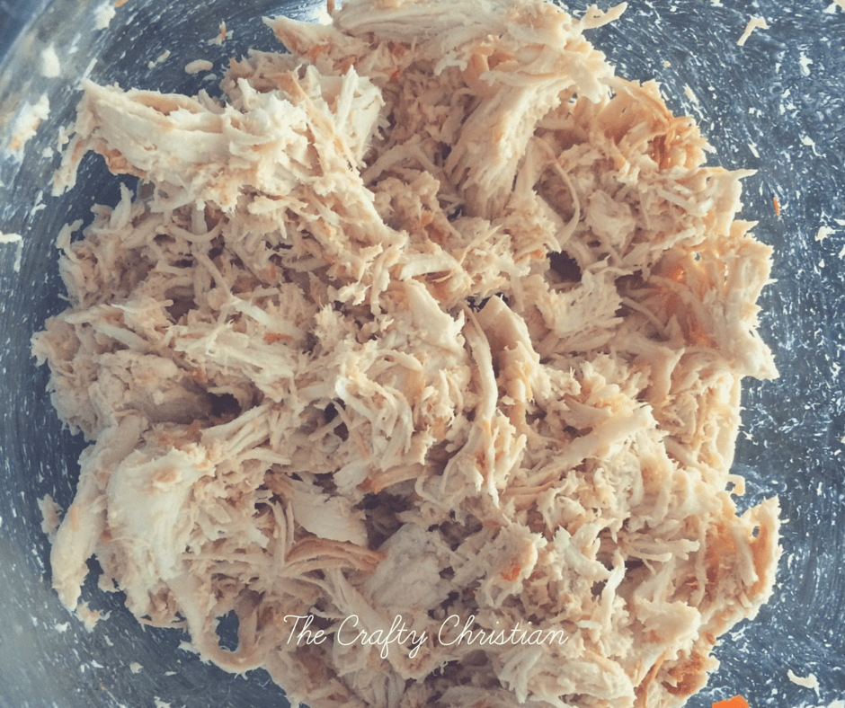 shredded chicken in a mixing bowl