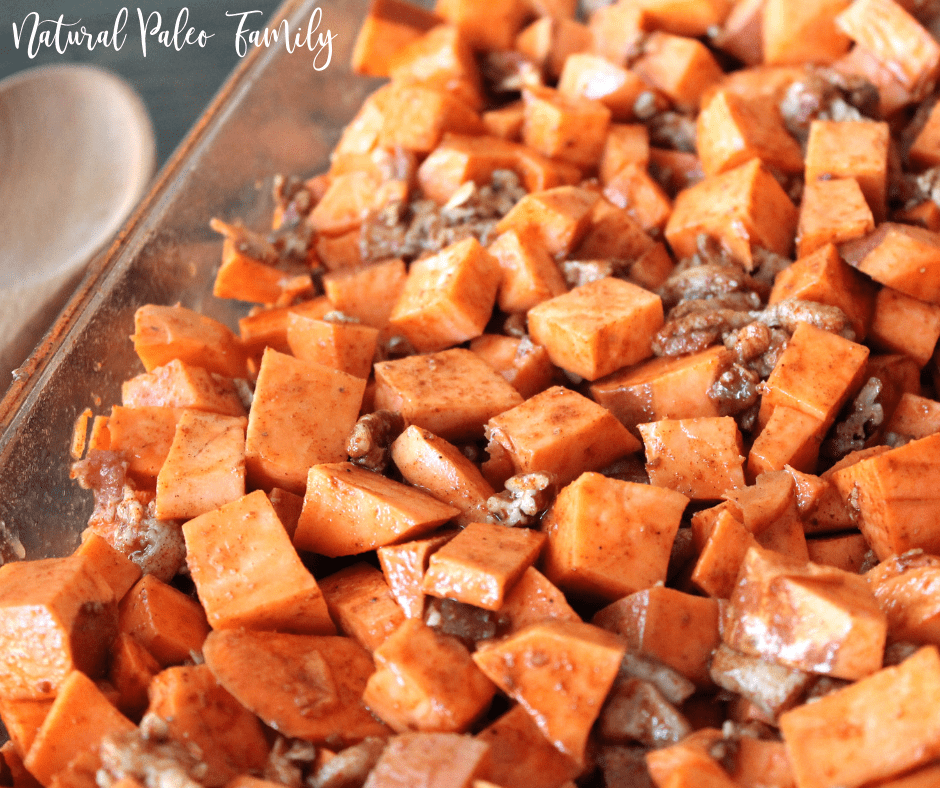Roasted bacon sweet potatoes in a glass baking dish