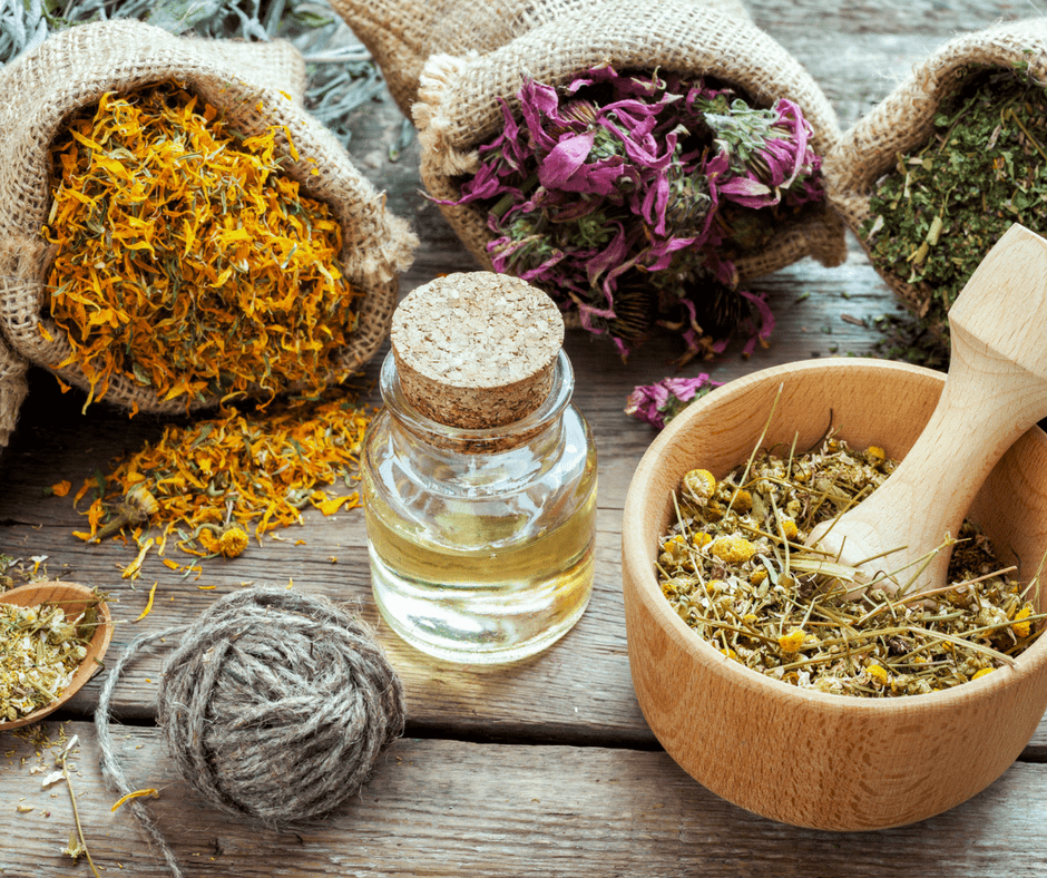 various herbs in burlap sacks