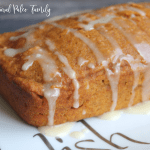 gluten free pumpkin angel food cake with glaze dripping off of the sides