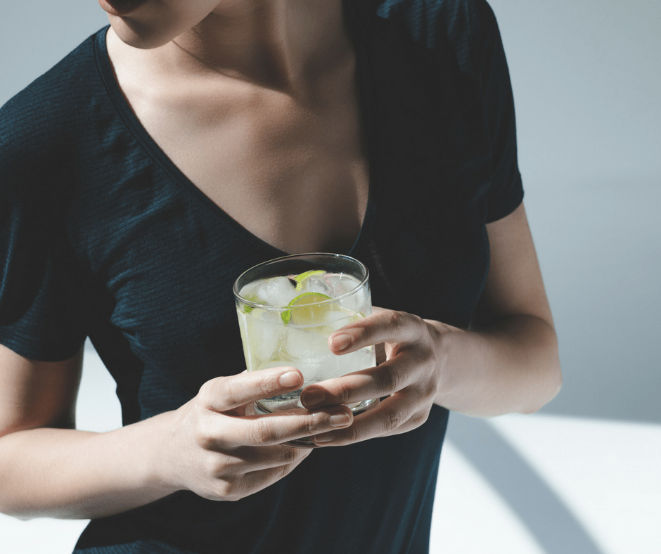 woman holding a gin and tonic