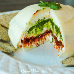 If you're looking for an incredibly flavorful holiday appetizer that will be a hit, then look no further than this pesto cheese blossom!