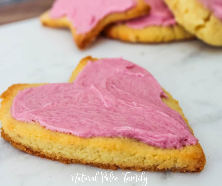 side angle of paleo valentine's day cookies on a marble slab