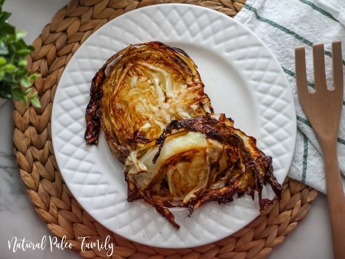 Garlic roasted cabbage on a white plate
