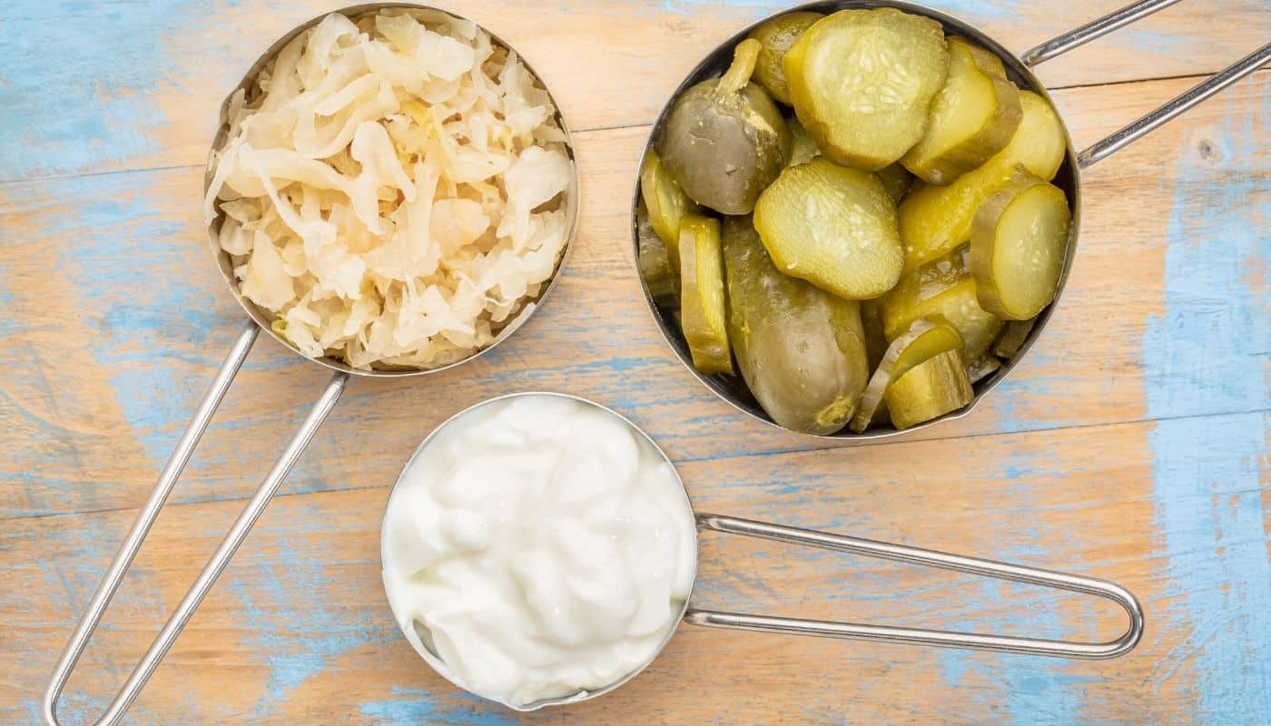 Healthy gut foods like pickles, sauerkraut, and yogurt